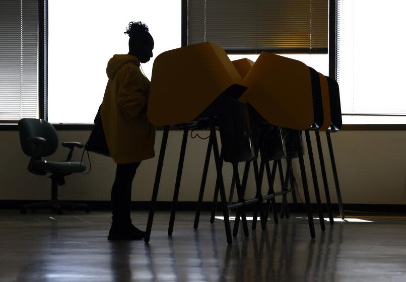 NORWALK-CA-MARCH 4, 2024: Mary Ann Roby, 72, of Downey, votes in the California primary election at the Los Angeles County Registrar Recorder in Norwalk on March 4, 2024. (Christina House / Los Angeles Times)