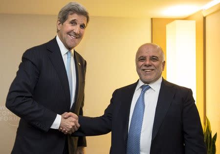 U.S. Secretary of State John Kerry shakes hands with Iraqi Prime Minister Haider al-Abadi at the 2016 World Economic Forum in Davos, Switzerland, January 21, 2016. REUTERS/Jacquelyn Martin/Pool