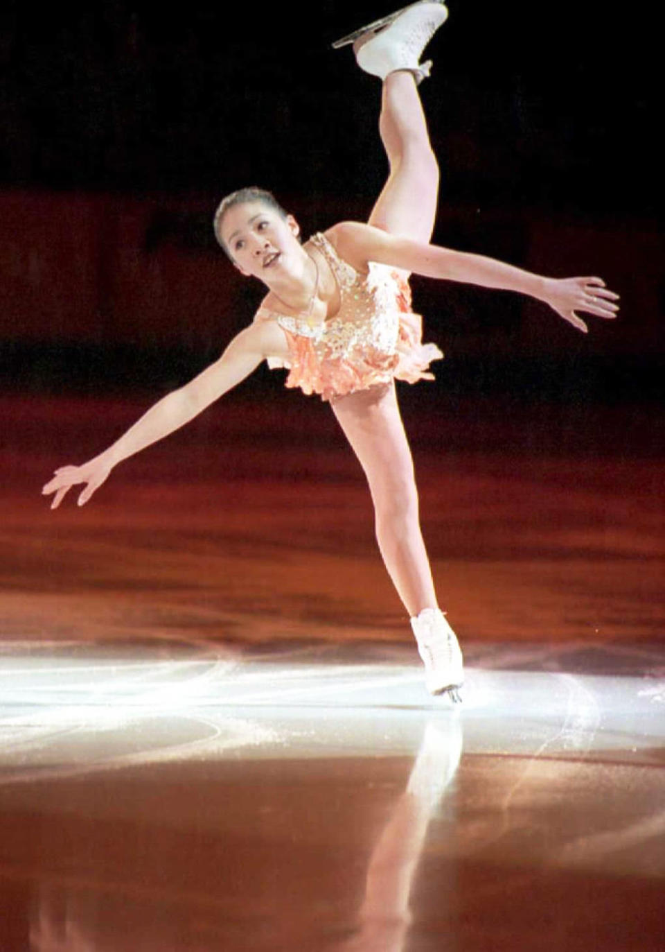 Michelle Kwan skates in the World Figure Skating Championships in 1996. (Photo: Carlo Allegri/AFP/Getty Images)