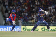 Delhi Capitals' captain and wicketkeeper Rishabh Pant, left, reacts after Lucknow Super Giants' captain KL Rahul, right, played a shot during the Indian Premier League cricket match between Lucknow Super Giants and Delhi Capitals in Lucknow, India, Friday, April 12, 2024. (AP Photo/Surjeet Yadav)