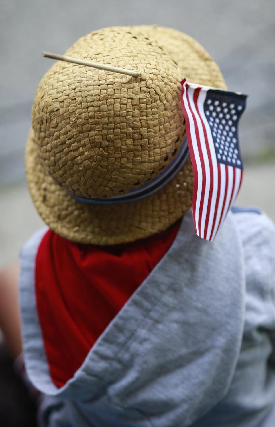 A young onlooker tucked a flag into his hat for the 2019 Upper Arlington Fourth of July parade.