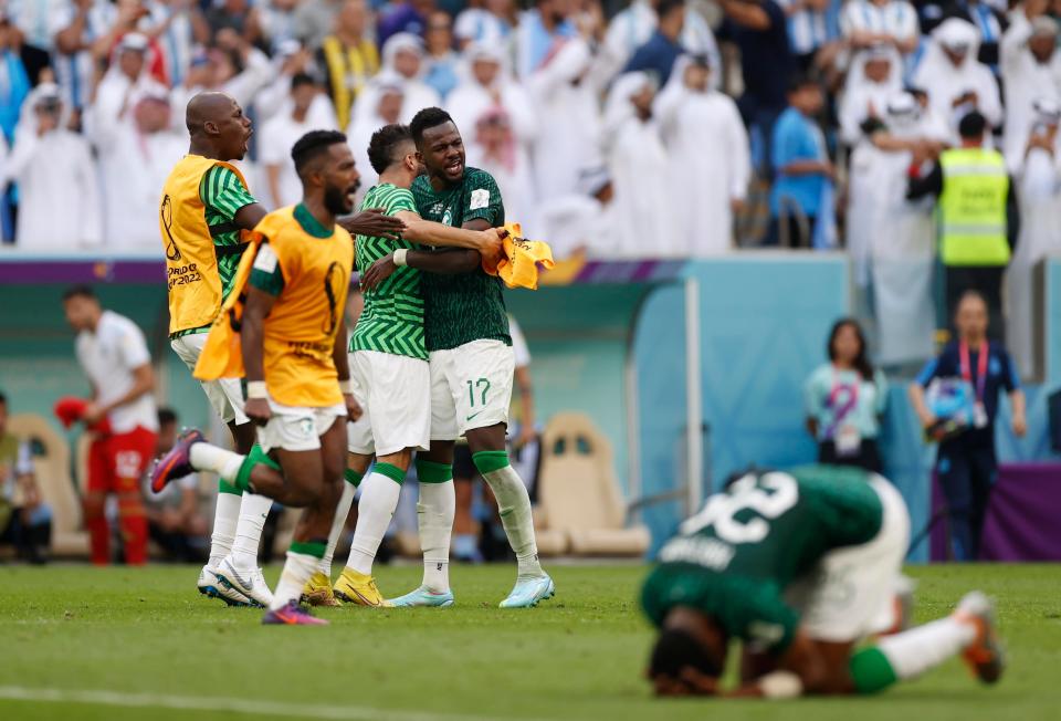 Nov 22, 2022; Lusail, Qatar; Saudi Arabia defender Hassan Tambakti (17) and teammates celebrate after defeating Argentina during a group stage match during the 2022 World Cup at Lusail Stadium. Mandatory Credit: Yukihito Taguchi-USA TODAY Sports