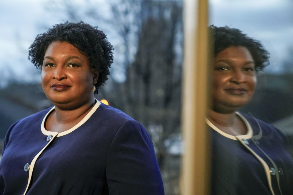 FILE - Georgia gubernatorial Democratic candidate Stacey Abrams poses for a photo during an interview with The Associated Press on Dec. 16, 2021, in Decatur, Ga. Georgia's 2022 election field will solidify this week as major party candidates officially qualify. At the top of the ticket are races for governor and U.S. senator. On the Democratic side, Stacey Abrams has no announced opposition for governor. Incumbent Republican Brian Kemp has multiple challengers including former U.S. Sen. David Perdue. (AP Photo/Brynn Anderson, File)