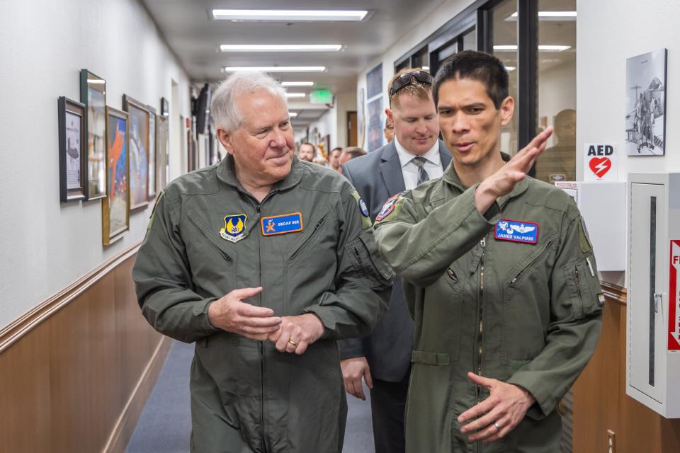 Col. James Valpiani, Air Force Test Pilot School commandant, provides final points of instruction to Secretary of the Air Force Frank Kendall during his visit to Edwards Air Force, California, May 2.