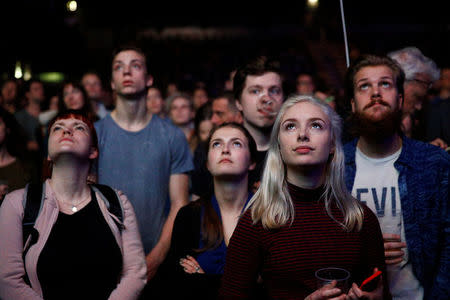 People listen to Dutch Green Party (Groen Links) leader Jesse Klaver during a meeting for the 2017 Dutch election in the AFAS theater in Amsterdam, Netherlands, March 9, 2017. REUTERS/Michael Kooren