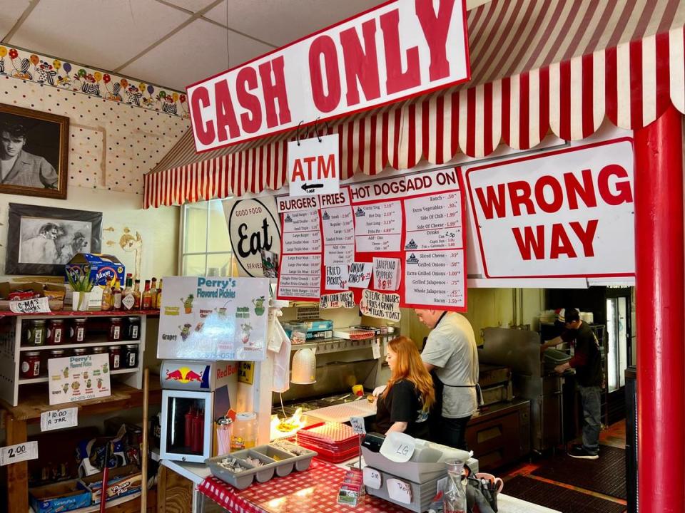 Signage is plentiful at Clown Burger in Haltom City May 18, 2023.