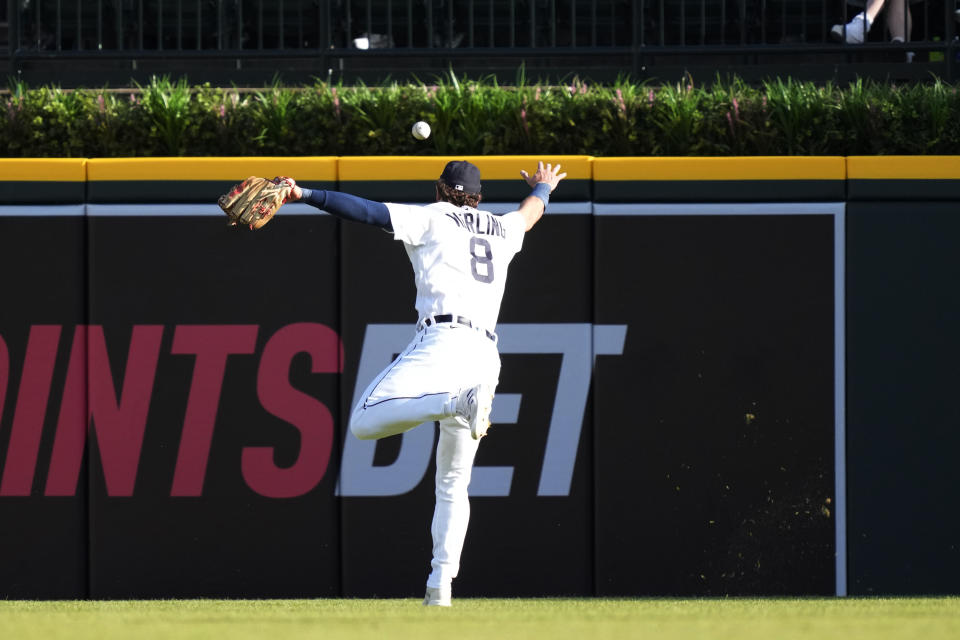 Detroit Tigers right fielder Matt Vierling misplays the RBI double hit by Chicago White Sox's Andrew Vaughn during the first inning of a baseball game, Friday, May 26, 2023, in Detroit. (AP Photo/Carlos Osorio)