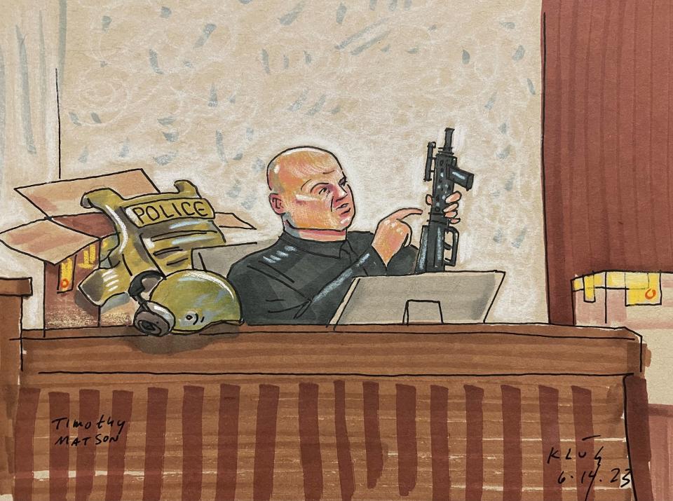 In this courtroom sketch, Pittsburgh SWAT Officer Timothy Matson, who was critically wounded while responding to the rampage, testifies, Wednesday, June 14, 2023, in Pittsburgh, in the federal trial of Robert Bowers. Bowers is accused of shooting to death 11 worshippers in a synagogue more than four years ago, the deadliest antisemitic attack in U.S. history. (David Klug via AP)