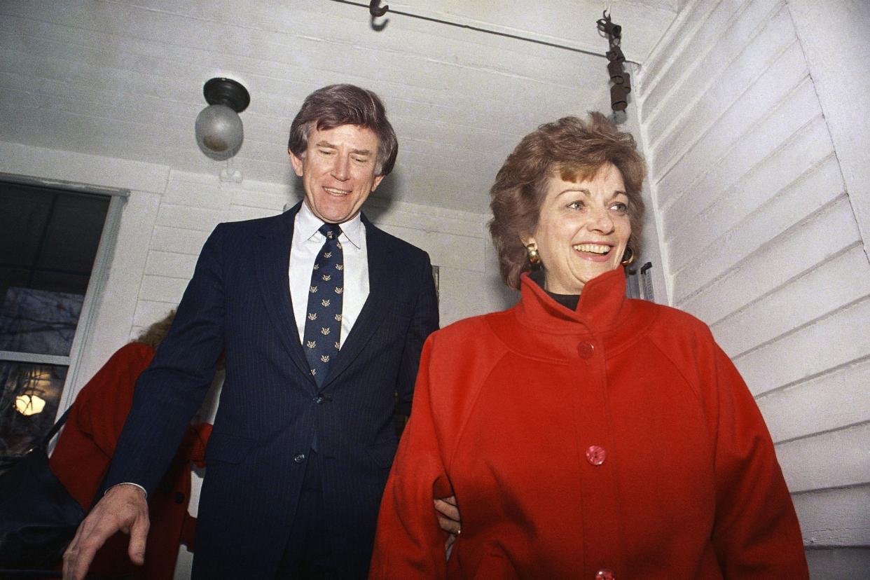 FILE - In this Dec. 15, 1987 file photo, Former Colorado Sen. Gary Hart and his wife Lee are all smiles as they leave the home, Dec. 15, 1987 of a Concord supporter enroute to the New Hampshire Secretary of State's office in Concord, N.H.. 