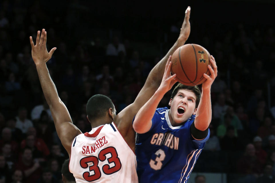 Creighton's Doug McDermott (3) shoots against St. John's Orlando Sanchez (33), of the Dominican Republic, during the first half of an NCAA college basketball game, Sunday, Feb. 9, 2014, in New York. (AP Photo/Jason DeCrow)