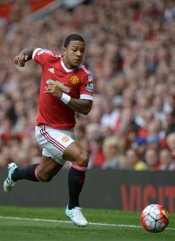 Manchester United's Dutch midfielder Memphis Depay runs with the ball during the English Premier League football match between Manchester United and Newcastle United at Old Trafford in Manchester, north west England, on August 22, 2015