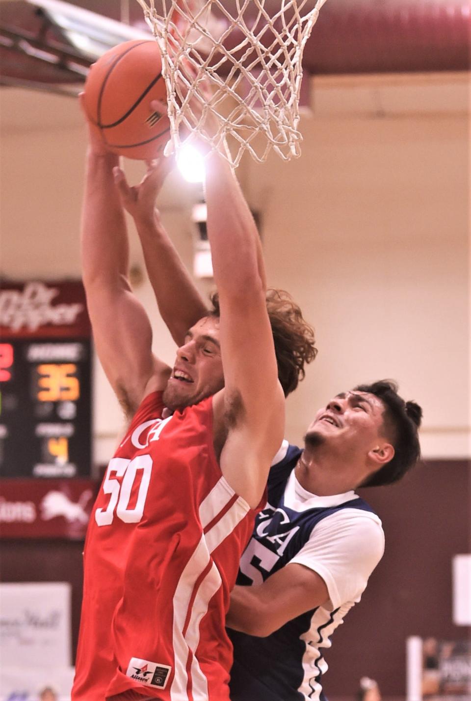 Wylie's Avery Brekke of the South team, left, grabs a rebound over Snyder's Eber Murillo of the North. The South beat the North 89-73 in the Big Country FCA's All-Star Men's Basketball Game on Saturday, June 4, at Brownwood High School.