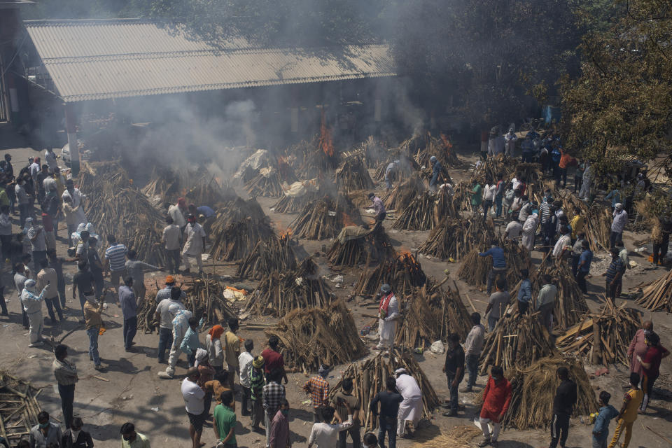 Multiple funeral pyres of those who died of Covid-19 burn at a ground that has been converted into a crematorium for the mass cremation of coronavirus victims, in New Delhi, India. Source: AP Photo/Altaf Qadri