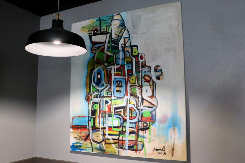 Harry's Bar & Grill showcases art made by locally-based friends of the owner, Hart Epstein, including this work by Des Moines-based artist Dave Whannel. This piece is pictured inside Harry's on Monday, Aug. 21, 2023.