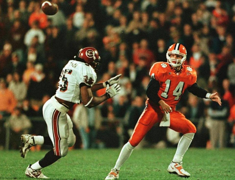 Clemson quarterback Brandon Streeter unloads a pass on his way to a 28-19 defeat of USC in 1998.