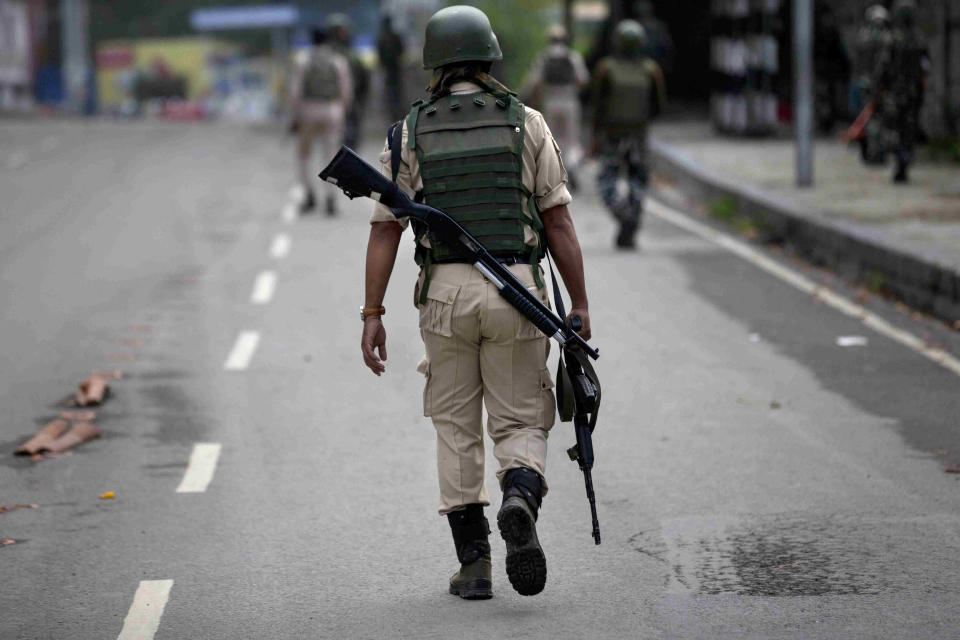 Indian paramilitary soldiers patrol on the road leading towards Independence Day parade venue during lockdown in Srinagar, Indian controlled Kashmir, Thursday, Aug. 15, 2019. Indian Prime Minister Narendra Modi says that stripping the disputed Kashmir region of its statehood and special constitutional provisions has helped unify the country. Modi gave the annual Independence Day address from the historic Red Fort in New Delhi as an unprecedented security lockdown kept people in Indian-administered Kashmir indoors for an eleventh day. (AP Photo/ Dar Yasin)