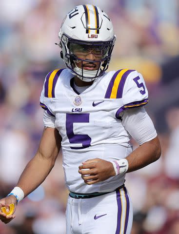 <p>Jonathan Bachman/Getty</p> Jayden Daniels during a game at Tiger Stadium on November 25, 2023 in Baton Rouge, Louisiana.