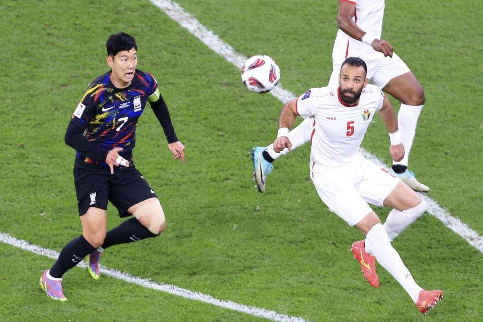 Jordan's Yazan Alarab, right, and South Korea's Son Heung-min eye the ball during the Asian Cup semifinal soccer match between South Korea and Jordan at Ahmad Bin Ali Stadium in Al Rayyan, Qatar, Tuesday, Feb. 6, 2024. (AP Photo/Hussein Sayed)