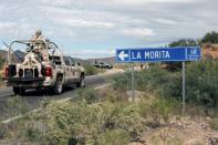 Security forces stood guard near the Mormon ranch