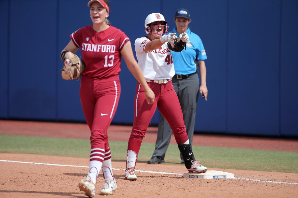 Oklahoma's Alynah Torres (40) celebrates beside Stanford's Emily Schultz (13) after a hit in the fifth inning of a softball game between University of Oklahoma Sooners (OU) and Stanford in the Women's College World Series at USA Softball Hall of Fame Stadium in Oklahoma City, Thursday, June 1, 2023. Oklahoma won 2-0.