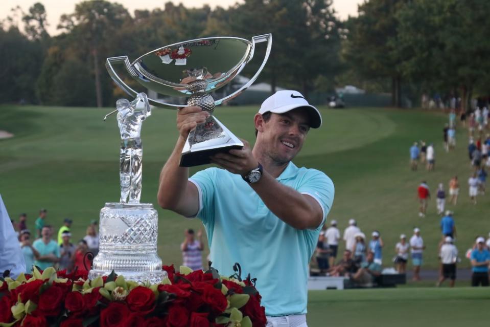 Rory McIlroy holds up the FedEx Cup trophy after winning on the 4th playoff hole at the final round of the 2016 PGA Tour Championship at East Lake Golf Club in Atlanta, Georgia. (Photo by Michael Wade/Icon Sportswire via Getty Images)