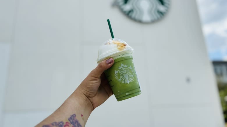 handheld Starbucks drink