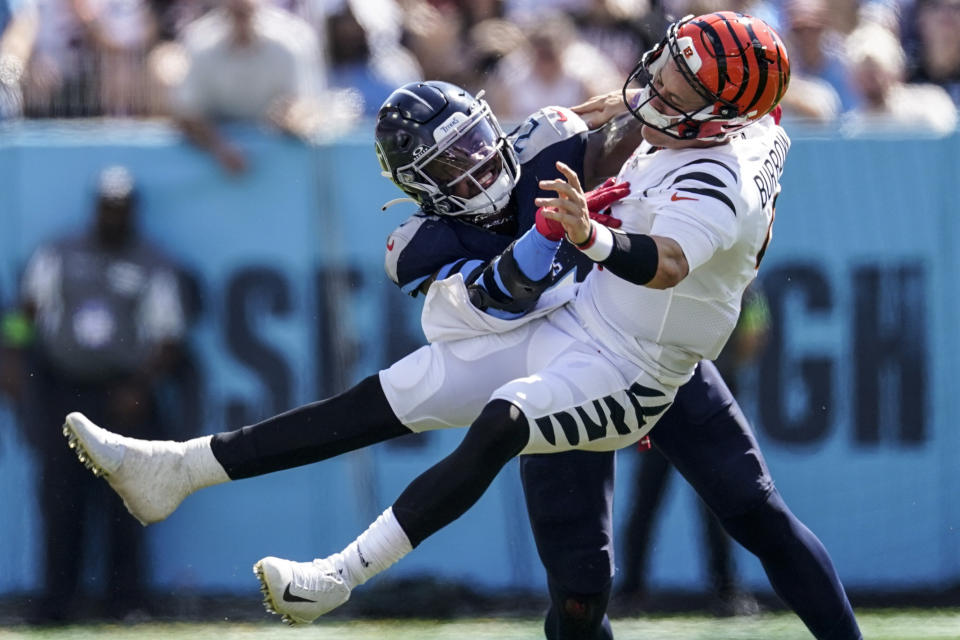 Tennessee Titans linebacker Azeez Al-Shaair (2) hits Cincinnati Bengals quarterback Joe Burrow (9) during the first half of an NFL football game, Sunday, Oct. 1, 2023, in Nashville, Tenn. (AP Photo/George Walker IV)