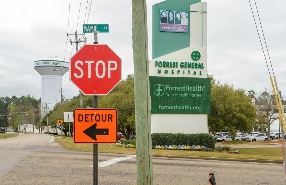 Signs and construction crews restrict some access to the emergency room at Forrest County General Hospital in Hattiesburg, Miss., Wednesday, March 16, 2022.