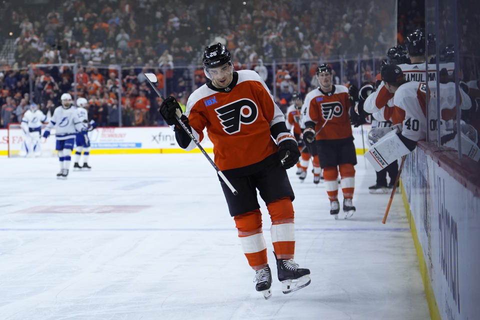 Philadelphia Flyers' Sean Walker reacts after scoring a goal during the third period of an NHL hockey game against the Tampa Bay Lightning, Tuesday, Feb. 27, 2024, in Philadelphia. (AP Photo/Matt Slocum)