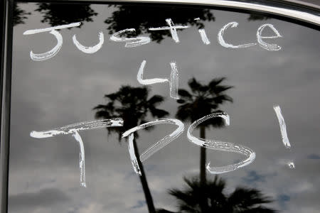 Paint is seen on cars before members of the Teamsters Union participate in a tractor trailer caravan surrounding the LA Metro Detention Center in support of port truck drivers and others threatened by deportation if the courts or congress don't stop the termination of Temporary Protected Status (TPS) in Los Angeles, California, U.S. October 3, 2018. REUTERS/Kyle Grillot