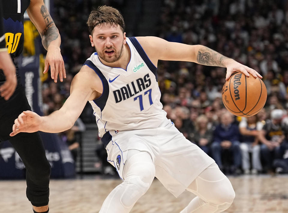 Dallas Mavericks guard Luka Doncic moves against the Denver Nuggets during the second quarter of an NBA basketball game Monday, Dec. 18, 2023, in Denver. (AP Photo/Jack Dempsey)