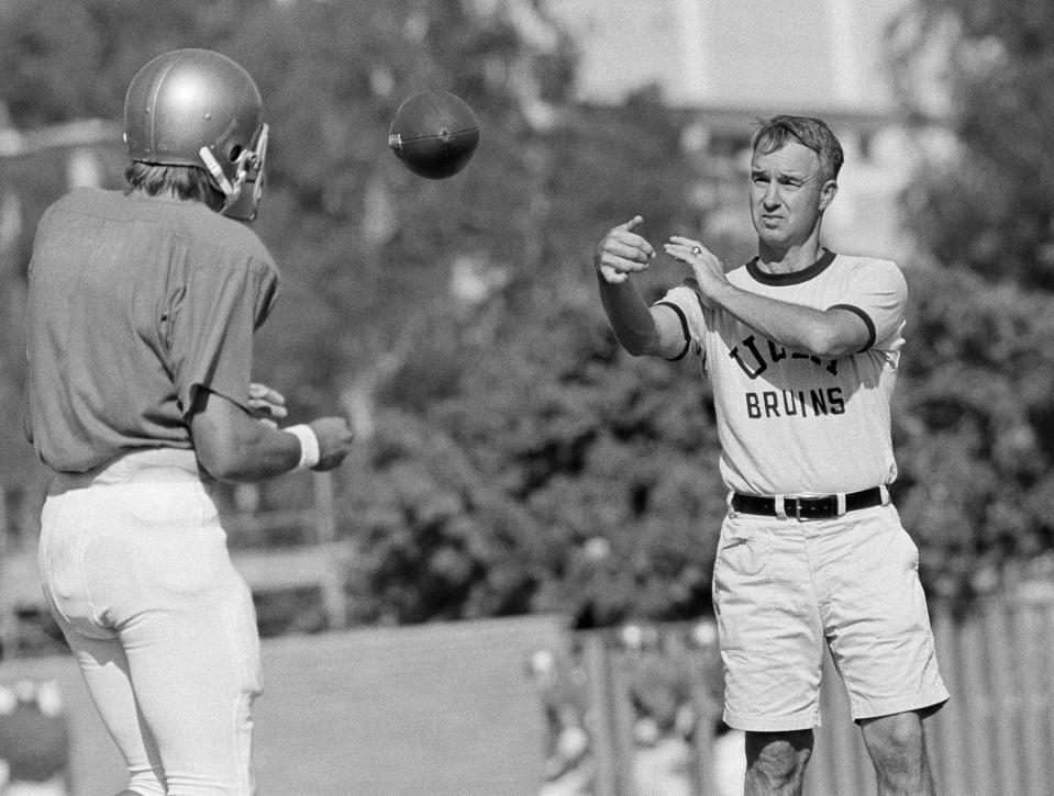 UCLA quarterback Mark Harmon son of former Michigan Heisman Trophy winner Tom Harmon, works out with Coach Pepper Rodgers on Tuesday, Sept. 13, 1972 in Los Angeles. After UCLA?s upset win over Nebraska lat week, Rodgers said ?Mark Harmon?s opening-game performance was better then that of the other quarterbacks I?ve had.? (AP Photo/GB)