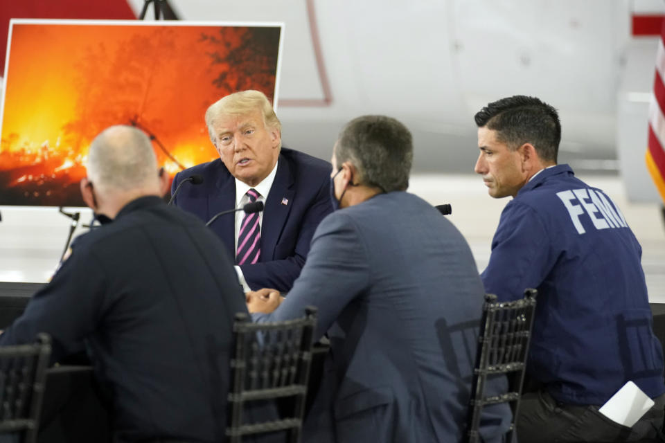 President Donald Trump speaks during a briefing at Sacramento McClellan Airport, in McClellan Park, Calif., Monday, Sept. 14, 2020, on the western wildfires. At right is acting Homeland Security Secretary Chad Wolf. (AP Photo/Andrew Harnik)