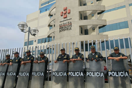 Police stand outside Centenario hospital after Peruvian President Pedro Pablo Kuczynski pardoned former President Alberto Fujimori in Lima, Peru, December 27, 2017. REUTERS/Guadalupe Pardo