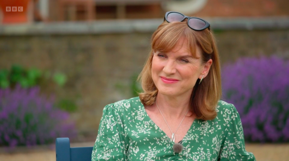 Fiona Bruce listening to the expert's origin story. (BBC screengrab)