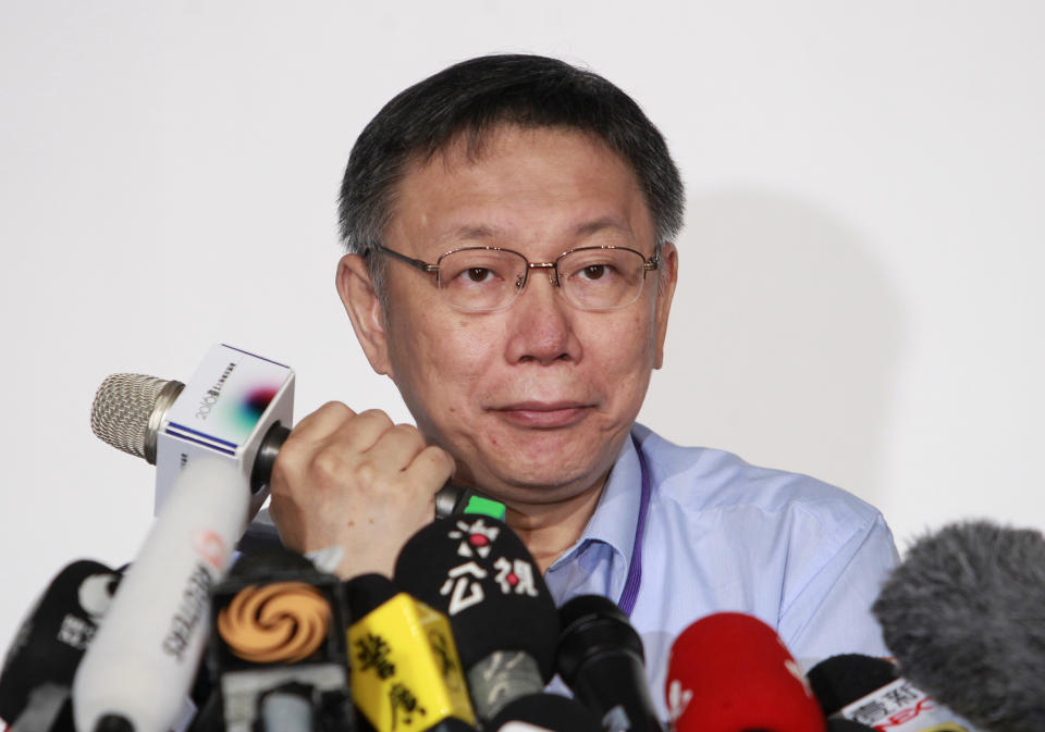 Taipei Mayor Ko Wen-je listens to press during the Taipei-Shanghai forum in Taipei, Taiwan, Tuesday, August 23, 2016. The Chinese envoy arrived in Taiwan on Monday for a city-to-city dialogue, amid a chill in relations between the sides following the inauguration of the island's independence-leaning president, Tsai ing-wen, in June. (AP Photo/ Chiang Ying-ying)