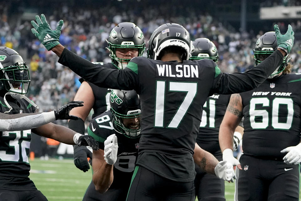 New York Jets wide receiver Garrett Wilson (17) celebrates with teammates after scoring a touchdown against the Chicago Bears during the first quarter of an NFL football game, Sunday, Nov. 27, 2022, in East Rutherford, N.J. (AP Photo/John Minchillo)