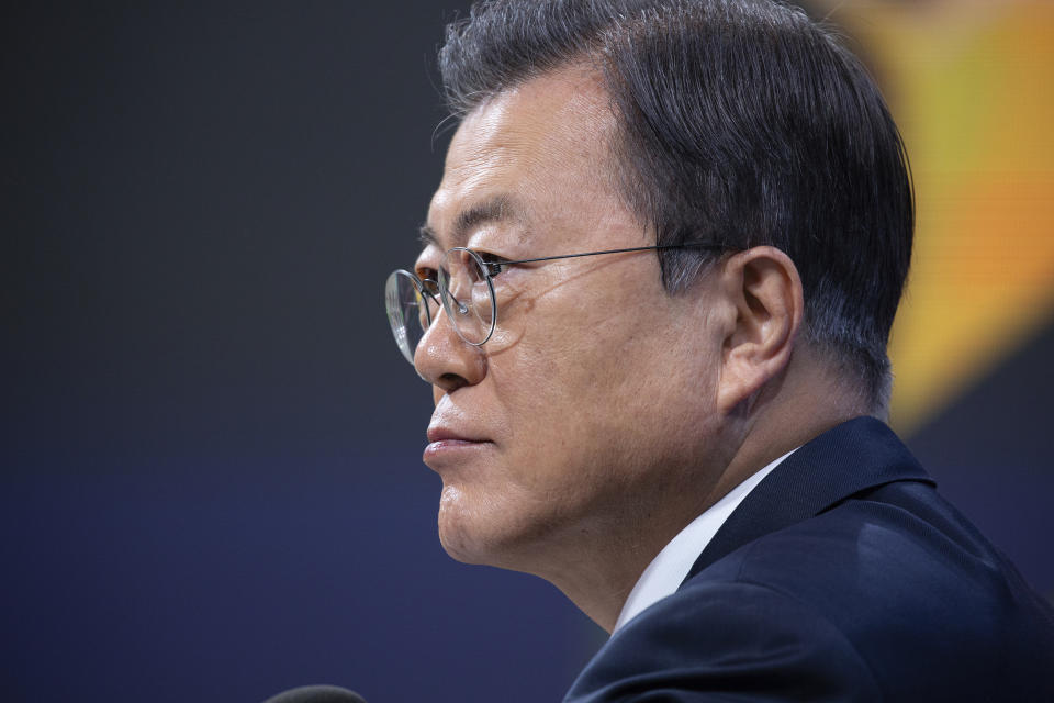 South Korean President Moon Jae-in speaks during an on-line New Year press conference with local and foreign journalists at the Presidential Blue House in Seoul, South Korea Monday, Jan. 18, 2021. (Jeon Heon-kyun/Pool Photo via AP)