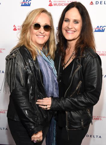 <p>Kevin Mazur/Getty</p> Melissa Etheridge and Linda Wallem attend MusiCares Person of the Year honoring Aerosmith on January 24, 2020 in Los Angeles, California.