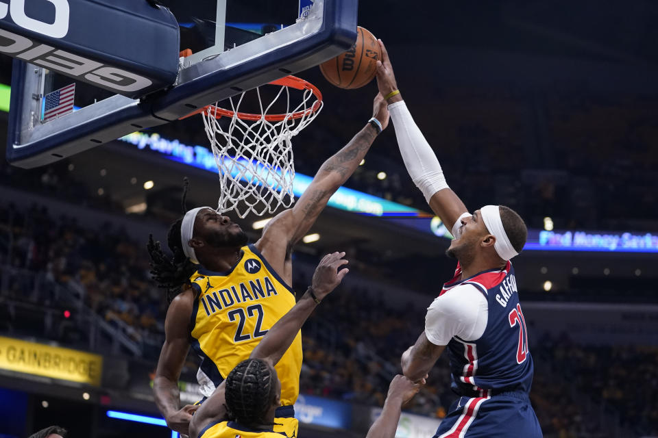 Washington Wizards' Daniel Gafford shoots against Indiana Pacers' Isaiah Jackson (22) during the first half of an NBA basketball game Wednesday, Oct. 19, 2022, in Indianapolis. (AP Photo/Michael Conroy)