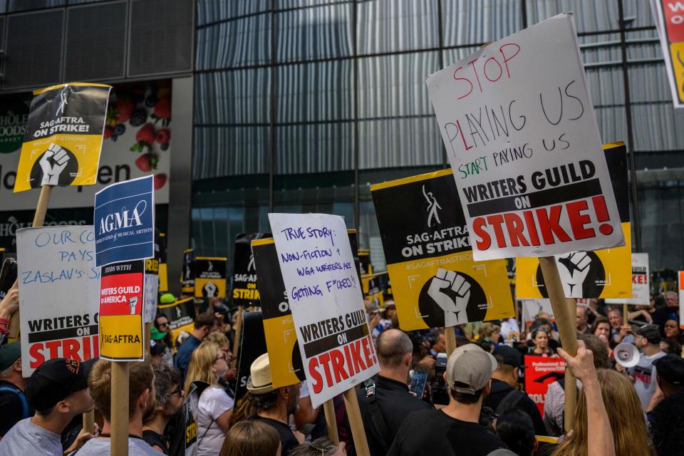 Actors, writers and other union members march on a picket line in front of the offices of HBO and Amazon in New York City on Aug. 22, 2023.