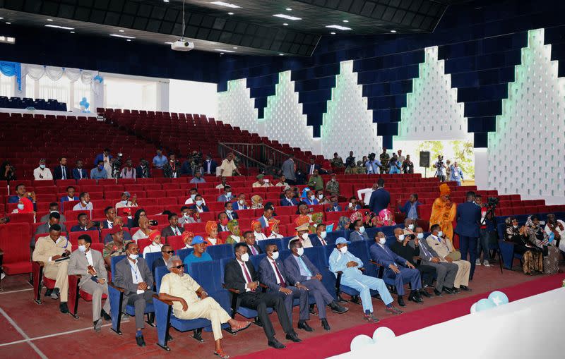 Somalia's President Mohamed Abdullahi Mohamed and government officials sit inside a renovated Somalia's National Theatre in Mogadishu