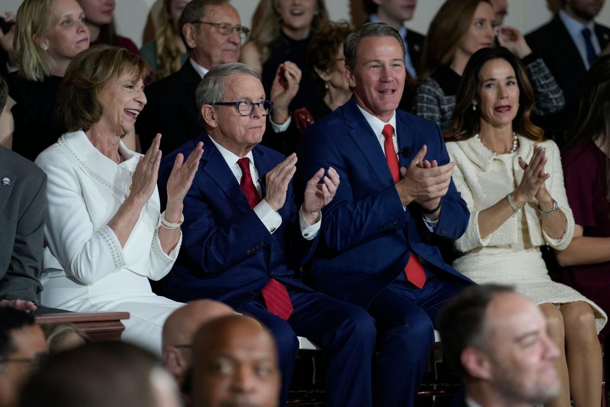 Jan 9, 2023; Columbus, Ohio, USA;  Fran DeWine, Ohio Governor Mike DeWine, Lieutenant Governor Jon Husted and his wife Tina Husted applaud a musical performance during an Inaugural ceremony at the Ohio Statehouse.  Mandatory Credit: Brooke LaValley/Columbus Dispatch