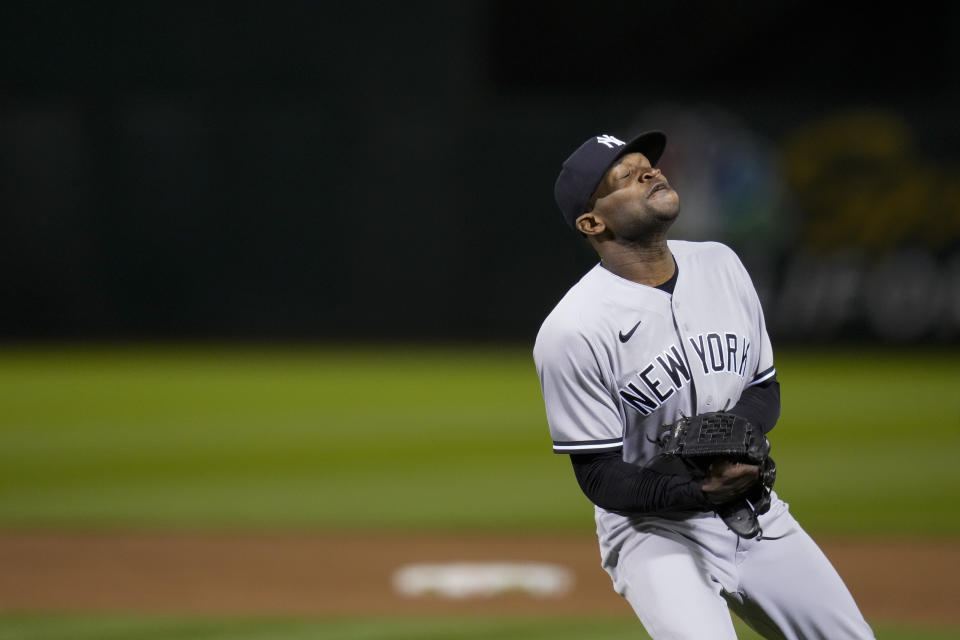 New York Yankees' Domingo Germán celebrates after pitching a perfect game against the Oakland Athletics during a baseball game in Oakland, Calif., Wednesday, June 28, 2023. The Yankees won 11-0. (AP Photo/Godofredo A. Vásquez)