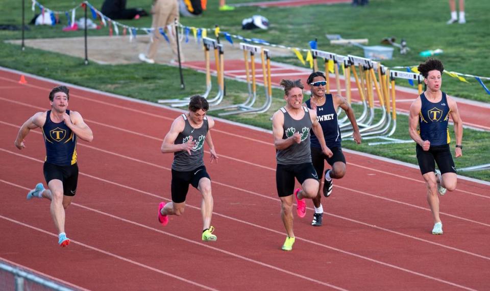 Pitman’s Joey Stout won the 100 meter dash with a time of 11.23 in the Stanislaus County track meet at Hughson High School in Hughson, Calif., Friday, March 24, 2023. Runners from the left, Turlock’s Peter Mello, placed third at 11.63, Pitman’s Blayne Siebert finished second at 11.24, Stout, fourth place Downey’s Rusty Jones 11.65, and Turlock’s Steven Salazar at 11.66 for fifth place.