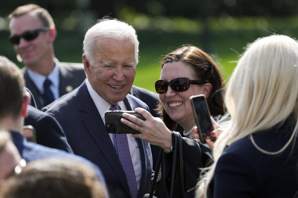 FILE - President Joe Biden poses for a photo as he greets people after speaking about the Americans with Disabilities Act (ADA) during an event on the South Lawn of the White House in Washington, Oct. 2, 2023. Despite a successful off-year election for Democrats, there remains a persistent fear within the party that there is a serious disconnect between the popularity of President Joe Biden's agenda and the man himself. (AP Photo/Susan Walsh, File)