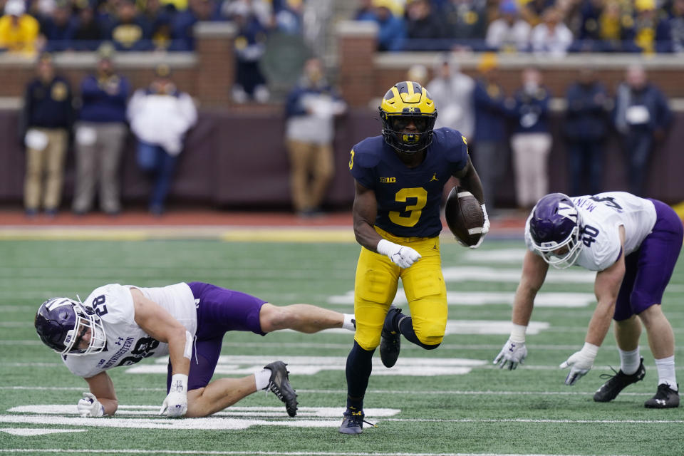 Michigan wide receiver A.J. Henning (3) rushes through the Northwestern defensive line during the first half of an NCAA college football game, Saturday, Oct. 23, 2021, in Ann Arbor, Mich. (AP Photo/Carlos Osorio)