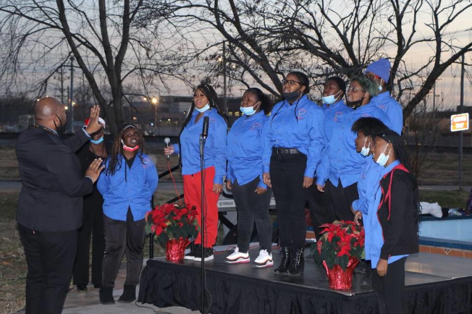 East St. Louis Senior High School Choir performs during the inaugural tree lighting ceremony in East St. Louis