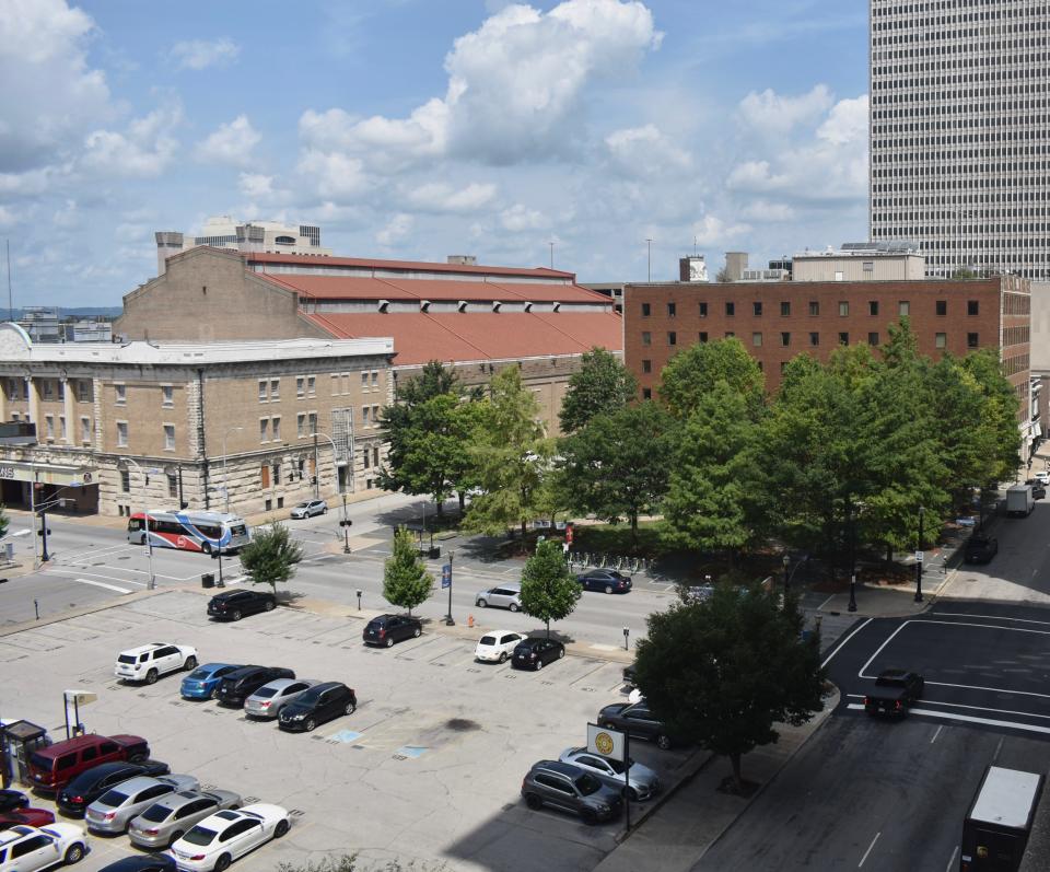 Founders Square provides an oasis of tree canopy in an otherwise mostly barren stretch of downtown Louisville. Nearby buildings, parking lots and other impervious surfaces contribute to the city's considerable urban heat island effect. Aug. 11, 2023