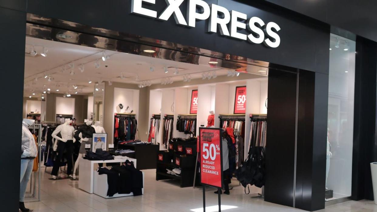 <div>The exterior of an Express clothing store is seen as the company announces it will close some stores on January 22, 2020 in Plantation, Florida. The clothing retailer announced that it plans to shutter roughly 100 of its stores by 2022, as part of its strategy three year strategy to save $80 million in costs annually. (Photo by Joe Raedle/Getty Images)</div>